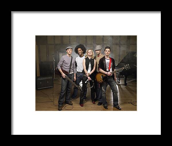 Young Men Framed Print featuring the photograph Portrait of a rock band by Image Source