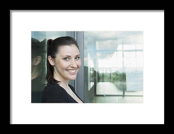 People Framed Print featuring the photograph Portrait of young woman smiling by Dreet Production