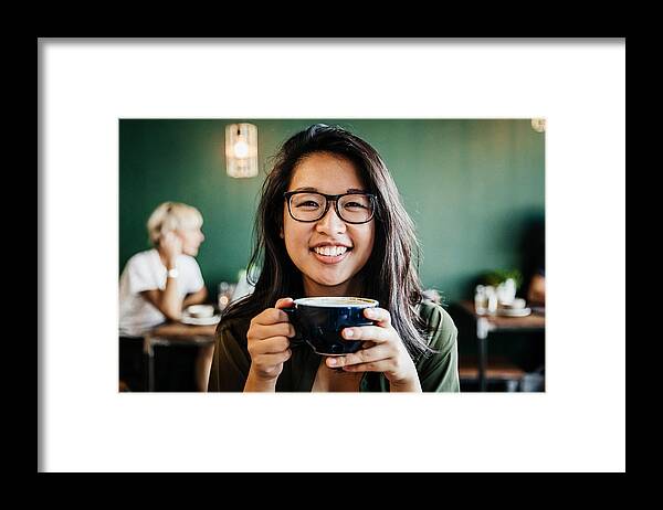 People Framed Print featuring the photograph Portrait Of Young Woman Smiling Drinking Coffee by Tom Werner