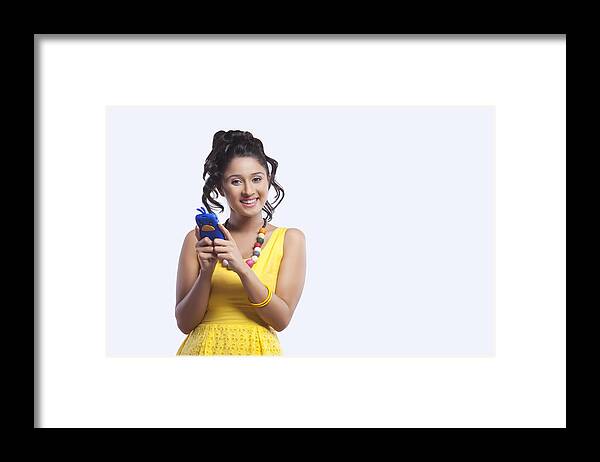 People Framed Print featuring the photograph Portrait of young woman with mobile phone by Sudipta Halder