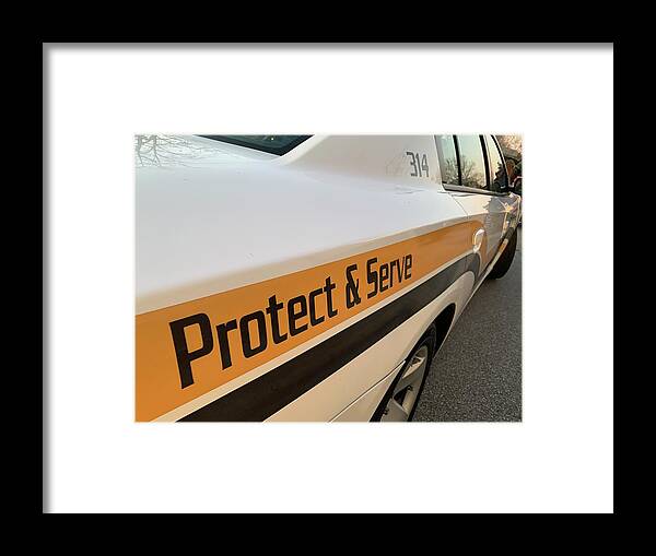 Protect Framed Print featuring the photograph Protect and Serve by Lee Darnell