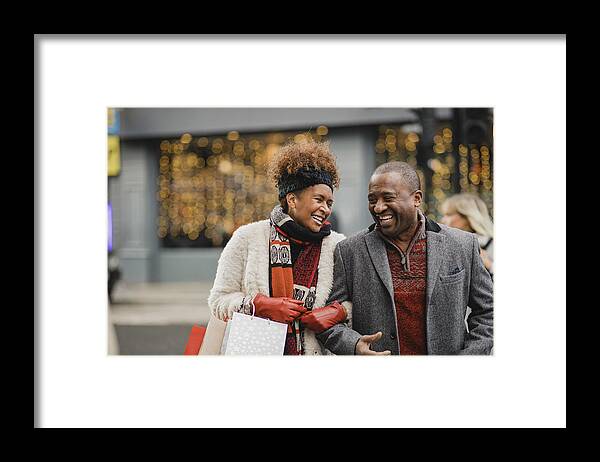 Mature Adult Framed Print featuring the photograph Quality Time Together at Christmas by SolStock