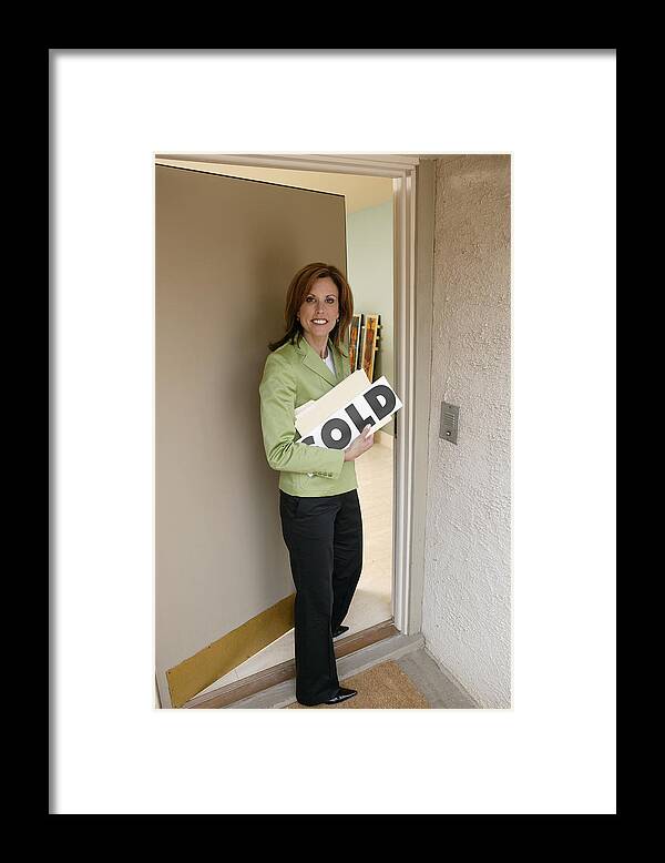 Mid Adult Women Framed Print featuring the photograph Realtor opening door by Comstock Images