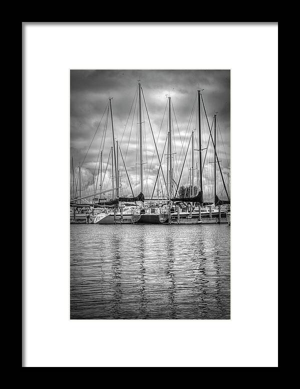 Boats Framed Print featuring the photograph Reflections and Boats at the Harbor in Black and White by Debra and Dave Vanderlaan