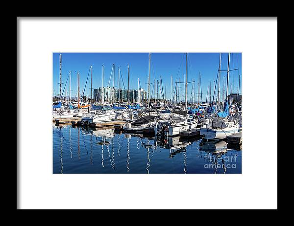 Sailboats Framed Print featuring the photograph Reflections of sailboats in blue water by Roslyn Wilkins