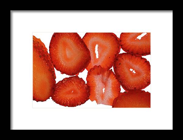 Strawberry Framed Print featuring the photograph Ripe Strawberry Slices on Light Table II by Charles Floyd