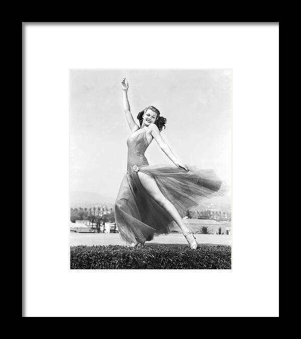 Rita Hayworth Framed Print featuring the photograph RITA HAYWORTH in YOU'LL NEVER GET RICH -1941-, directed by SIDNEY LANFIELD. by Album