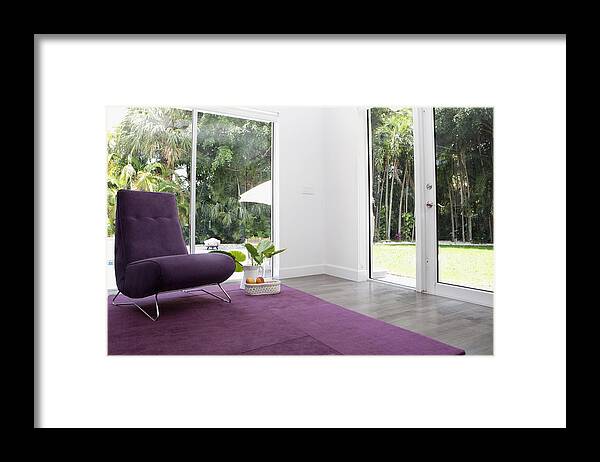 Rug Framed Print featuring the photograph Rug, chair and windows in modern living room by Camilo Morales