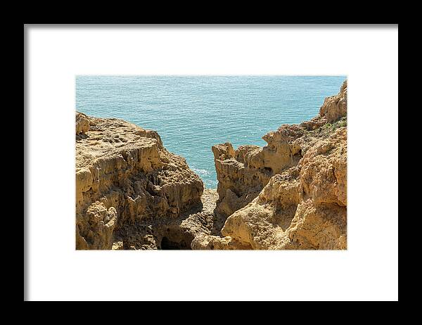 Sea Sculpted Framed Print featuring the photograph Sculpted Clifftops - Carvoeiro Algarve Gold Coast in Portugal by Georgia Mizuleva