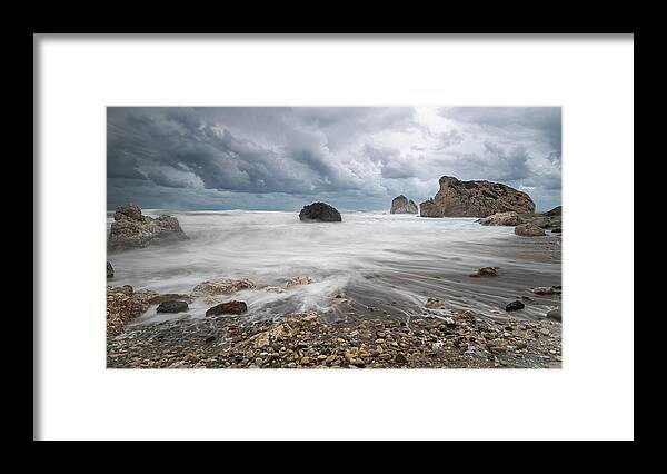 Seascape Framed Print featuring the photograph Seascape with windy waves during storm weather at the a rocky co by Michalakis Ppalis