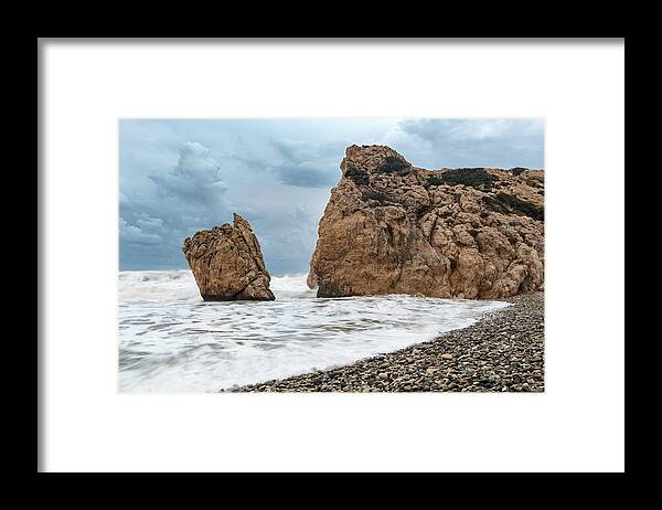 Coastline Framed Print featuring the photograph Seascapes with windy waves. Rock of Aphrodite Paphos Cyprus by Michalakis Ppalis