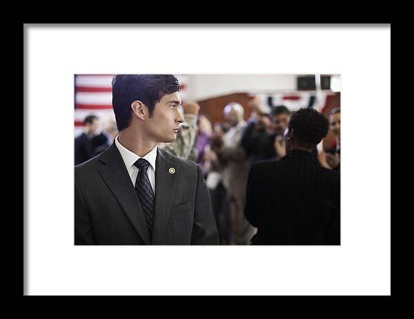 50-54 Years Framed Print featuring the photograph Security guard at political gathering by Hill Street Studios