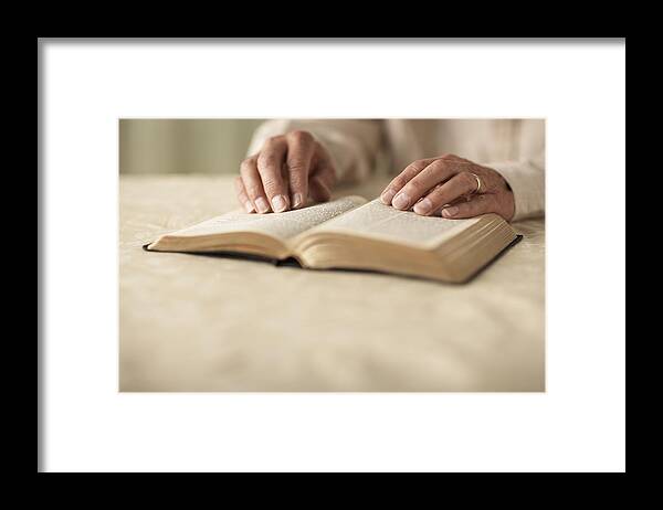 One Man Only Framed Print featuring the photograph Senior man reading Bible, close-up of hands by Thomas Northcut