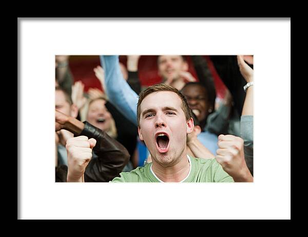 Young Men Framed Print featuring the photograph Shouting man at football match by Image Source