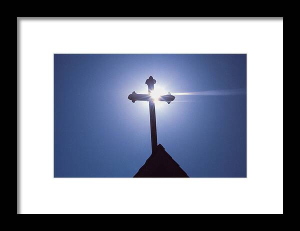 Greece Framed Print featuring the photograph Silhouette of a cross on the roof of a church, Greece by Medioimages/Photodisc