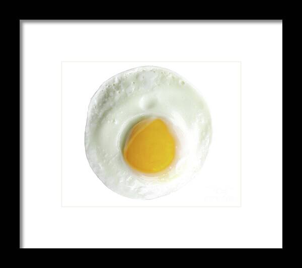 Sunny Side Framed Print featuring the photograph Single egg, sunny side up, isolated on white, perfect yolk in ce by Pete Klinger