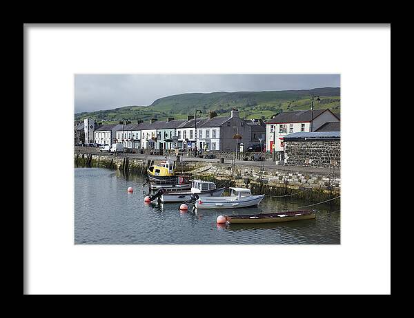 Residential District Framed Print featuring the photograph Skyline of the fishing village of Carnlough by Allan Baxter