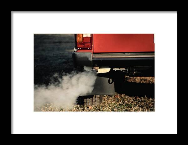 Grass Framed Print featuring the photograph Smoke Coming from Exhaust Pipe of a Car by Hisham Ibrahim