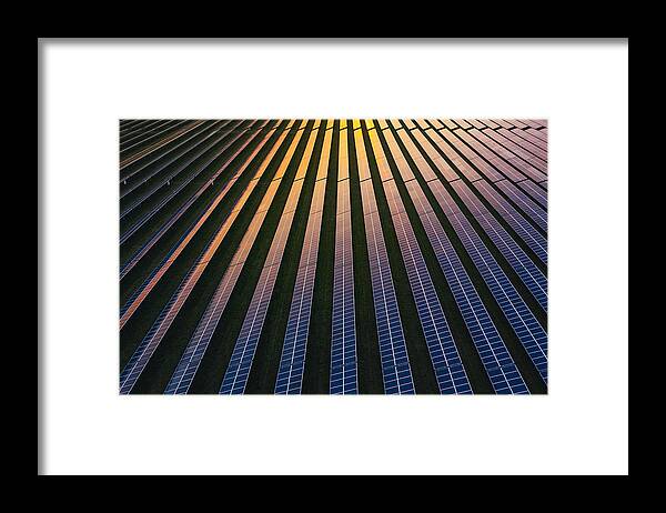 Environmental Conservation Framed Print featuring the photograph Solar panels at dusk by Justin Paget