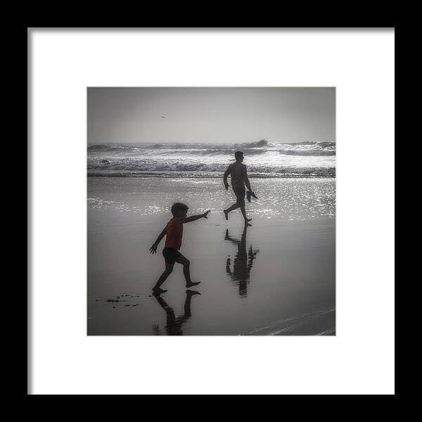 Son And Dad Framed Print featuring the photograph Son and dad, Ocean Beach by Donald Kinney