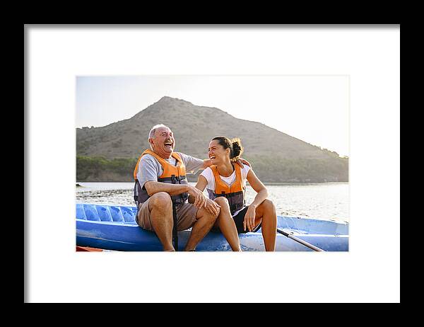 Scenics Framed Print featuring the photograph Spanish male and female enjoying early morning kayaking by JohnnyGreig