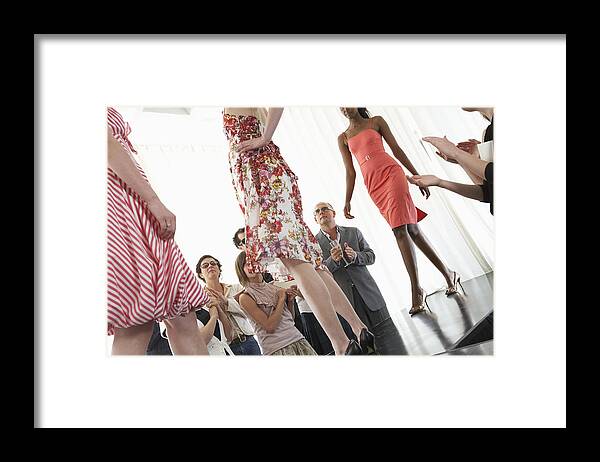 People Framed Print featuring the photograph Spectators applauding for models on runway during fashion show by Rob Melnychuk