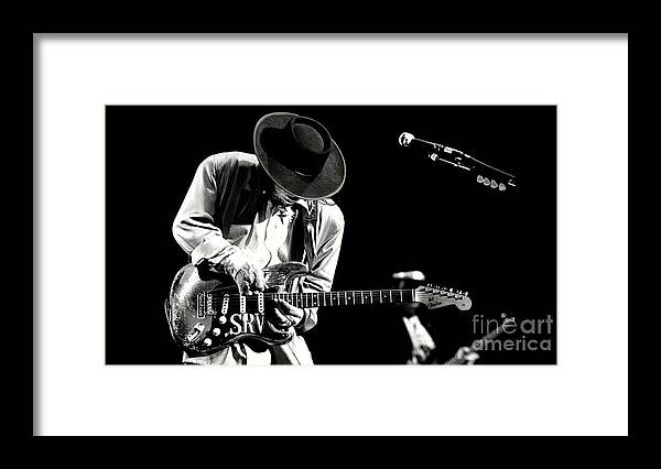 Stevie Ray Vaughan Framed Print featuring the photograph Stevie Ray Vaughan in concert by Action