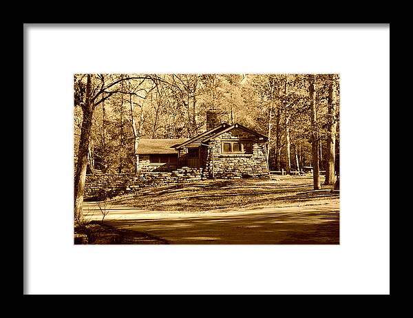 Stone Cabin Framed Print featuring the photograph Stone cabin in the Woods Sepia by Stacie Siemsen