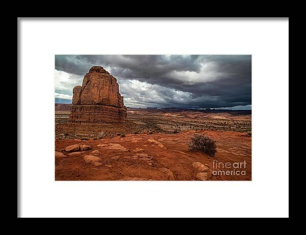 Arches National Park Framed Print featuring the photograph Storm Clouds over Arches National Park in Moab Utah by Ronda Kimbrow