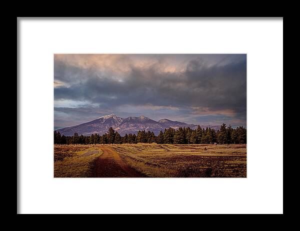 Wetlands Framed Print featuring the photograph Stormy Skies by Laura Putman