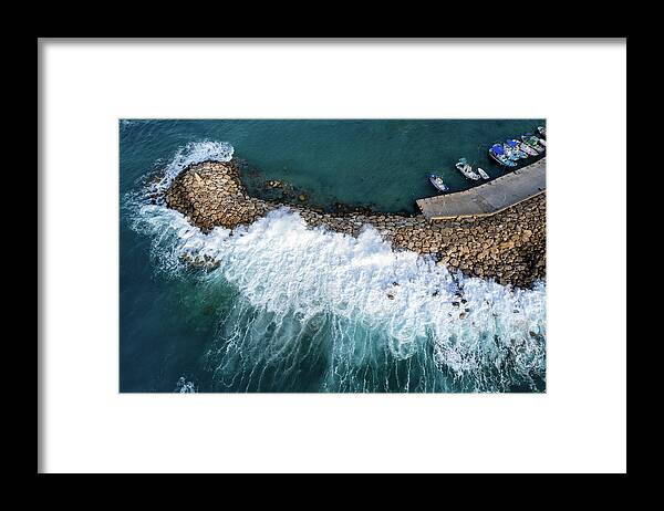 Brakewater Framed Print featuring the photograph Stormy windy waves on the shore. Drone photography. by Michalakis Ppalis