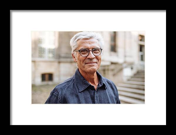 Heterosexual Couple Framed Print featuring the photograph Street portrait of smiling senior man by Kate_sept2004
