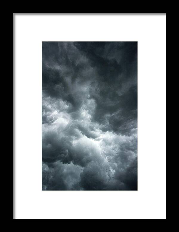 Clouds Framed Print featuring the photograph Stormy clouds in the sky. by Bernhard Schaffer