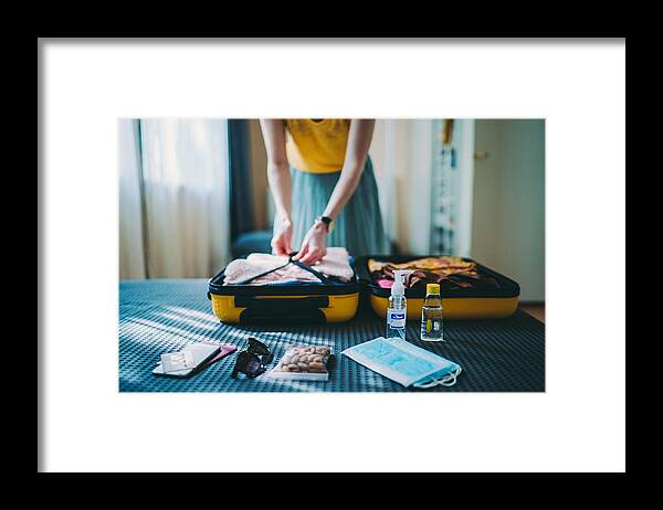 Cold And Flu Framed Print featuring the photograph Suitcase packing for travel, COVID-19 by Martin-dm