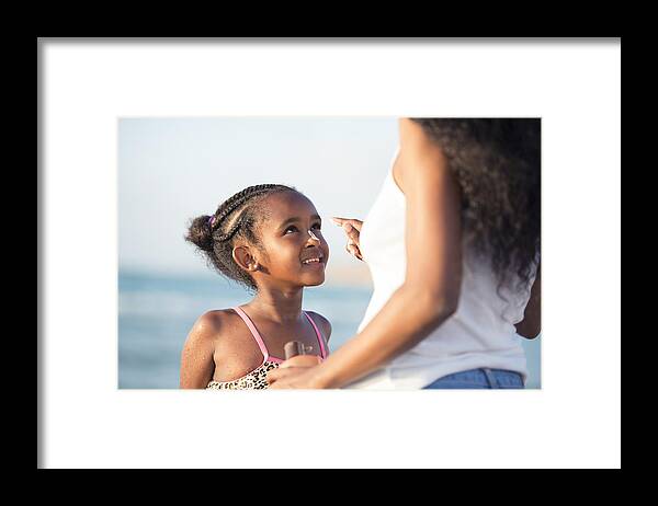 Toddler Framed Print featuring the photograph Sun protection for a healthy child skin. by RuslanDashinsky