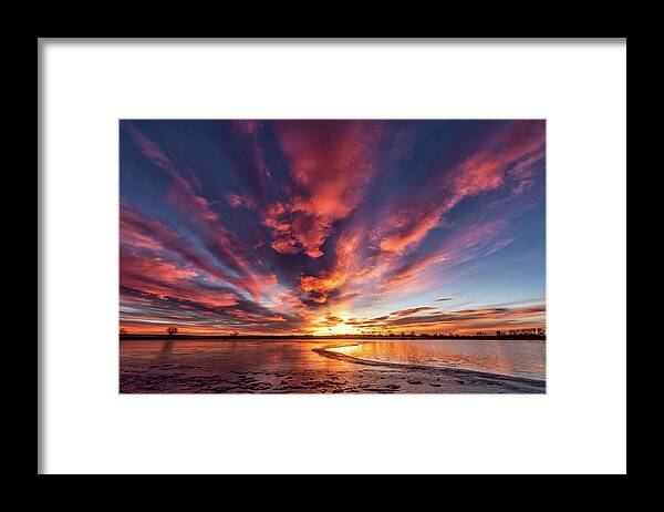 Sunrise Framed Print featuring the photograph Sunrise Over a Half Frozen Lake by Tony Hake