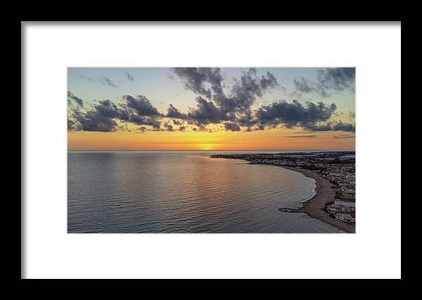 Aerial Framed Print featuring the photograph Sunset over the sea by Mirko Chessari