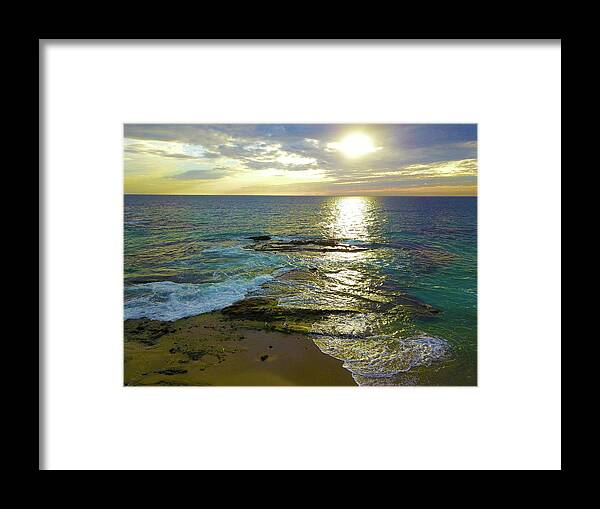 Ocean Framed Print featuring the photograph Sunset Over the Waves by Marcus Jones