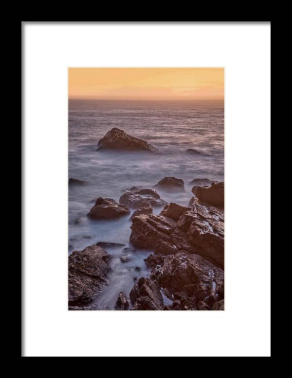 Ocean Cove Framed Print featuring the photograph Surf and Rocks at Dusk by Jurgen Lorenzen