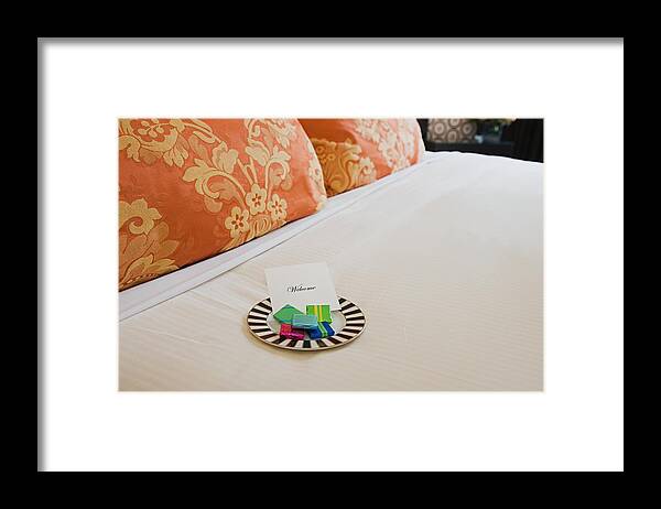 Home Decor Framed Print featuring the photograph Sweets on a hotel bed by Image Source