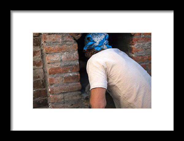 Expertise Framed Print featuring the photograph Taking the bread out of the oven by Jacobo Zanella