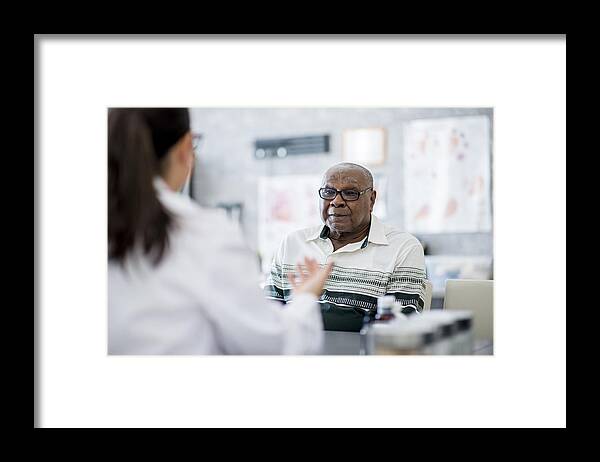 People Framed Print featuring the photograph Talking To His Doctor by FatCamera