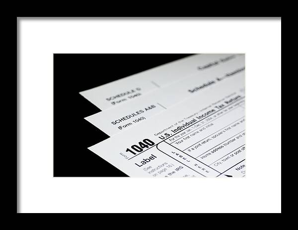 Black Color Framed Print featuring the photograph Tax Forms on Black by Leezsnow