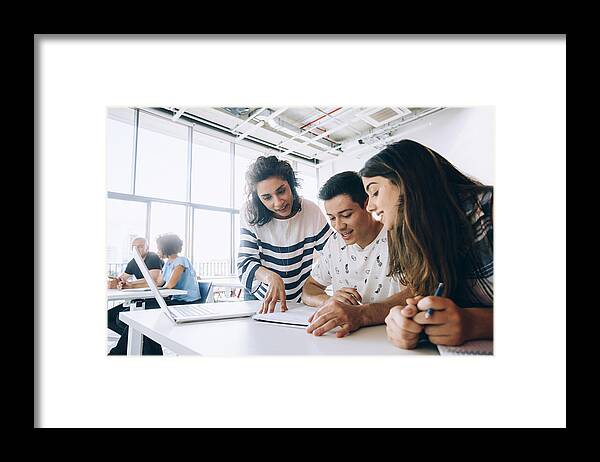 Education Framed Print featuring the photograph Teacher helping students by Cesar Okada