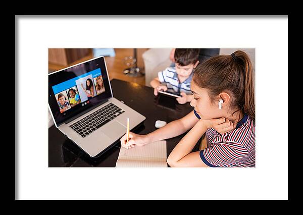 Bulgaria Framed Print featuring the photograph Teenage girl studying with video online lesson at home  family in isolation Homeschooling and distance learning by Valentinrussanov