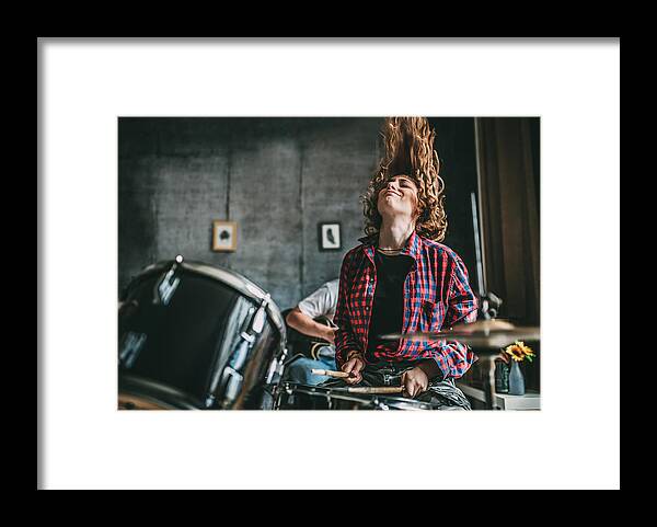 Rock Music Framed Print featuring the photograph Teenager Playing Rock and Roll At Home by Zeljkosantrac