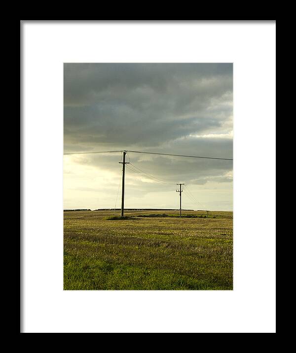 Dorset Framed Print featuring the photograph Telegraph poles in field and cloudy sky by Lyn Holly Coorg