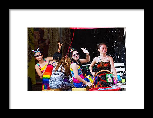 People Framed Print featuring the photograph Thai women having Songkran party on sidewalk by Justhavealook