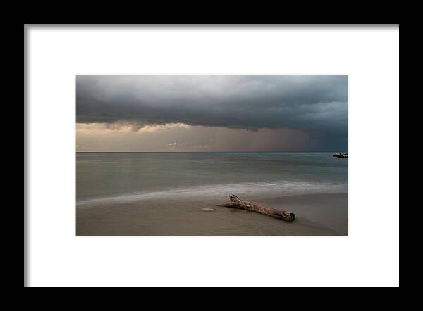 Storm Framed Print featuring the photograph The coming of the storm from ocean by Michalakis Ppalis