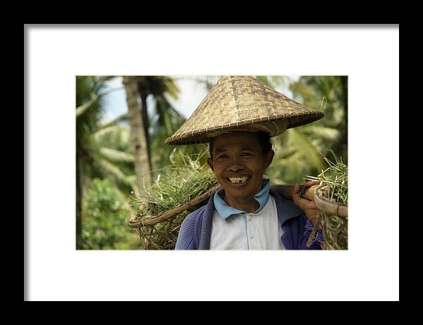 Indonesia Framed Print featuring the photograph The Life She Carries by Damian Morphou